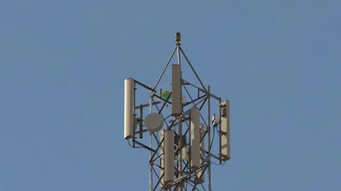 Kite dangling from cellular tower zoom out wide shot. Stock Footage 184529272