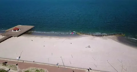 Kite flying above beach Stock Footage 138536132