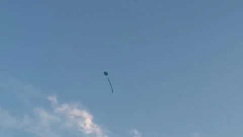 Kite flying alone in the sky. Kite floating in clear and windy weather Stock Footage 252581160