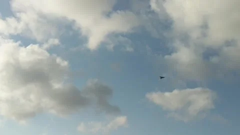 Kite flying in a clear and cloudy sky Stock Footage 242723194
