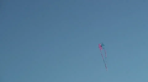Kite flying in clear blue sky Stock Footage 68702896