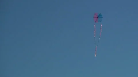 Kite flying in clear blue sky Stock Footage 68709830