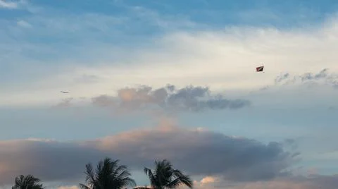 Kite Flying in a Cloudy Sky Stock Photos