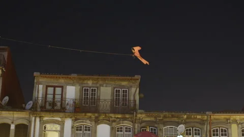 Kite flying over Porto rooftops at night Stock-Footage 300647987