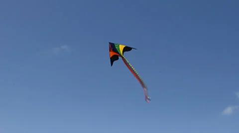 Kite flying under blue sky 8967 Stock Footage 26721114