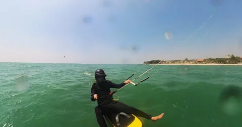 Kite Foiling Sitting Down; Kite Surfer Finding Center Balance On A Video stock 274335792