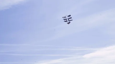 Kite in form of ship in flight against blue sky and sunny day Stock Footage 76264290