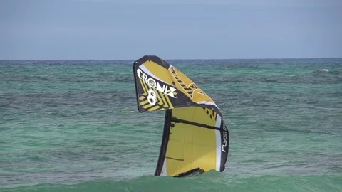 Kite rising up in the air from the sea in slow motion Stock Footage