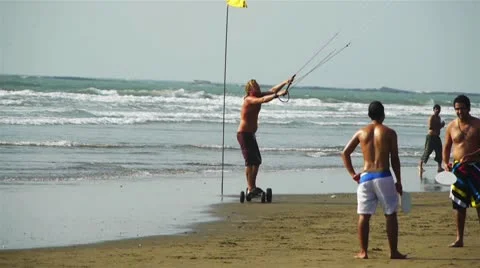 Kite skateboarder at a beach Stock Footage 10792101