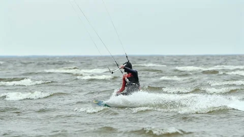 Kite surfer cuts a wave Stock Footage 117294475