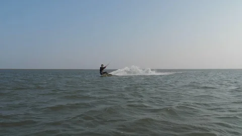 Kite surfer does Riley and Handle Pass slow motion Stock Footage 118824914
