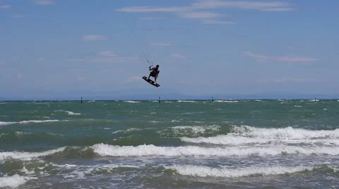 Kite surfer jumps over wave 動画素材 51378396