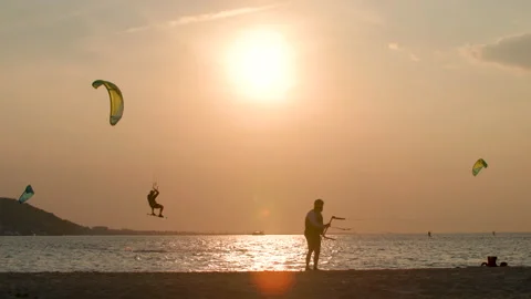 Kite surfer jumps at sunset Stock Footage 158498822