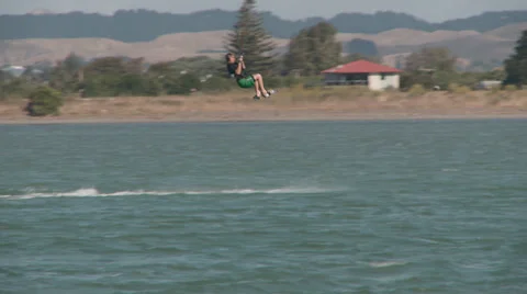 Kite surfer performs a jump Stock Footage 36722905