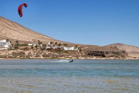 Kite surfer practices in a lagoon Stock Photos