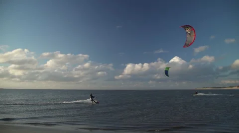 Kite surfer rides the flat Wadden Sea in Northern Germany Stock Footage 63913678