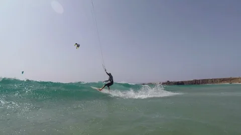 The kite surfer rides the waves of the Atlantic Ocean Stock Footage 120981683