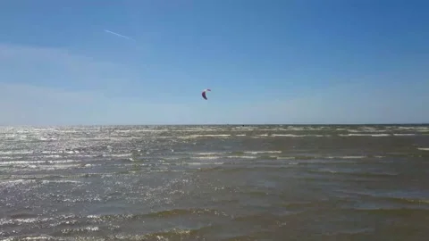 Kite surfer riding the waves Stock Footage 143355492