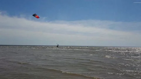 Kite surfer riding the waves Stock Footage 143903540