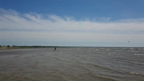 Kite surfer riding the waves Stock Footage 143903546
