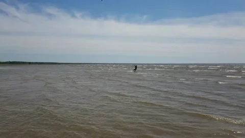 Kite surfer riding the waves Stock Footage 143903577