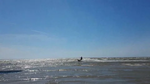 Kite surfer riding the waves Stock Footage 143903592