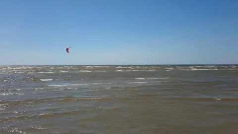 Kite surfer riding the waves Stock Footage 143903600