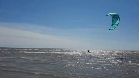 Kite surfer riding the waves Stock Footage 143903648