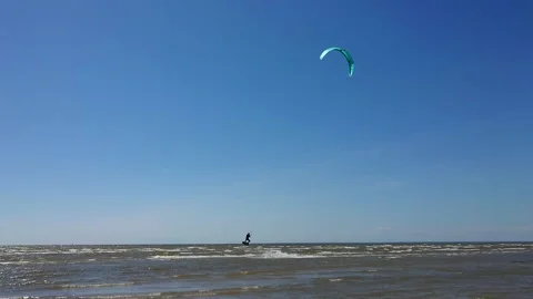 Kite surfer riding the waves Stock Footage 143903690