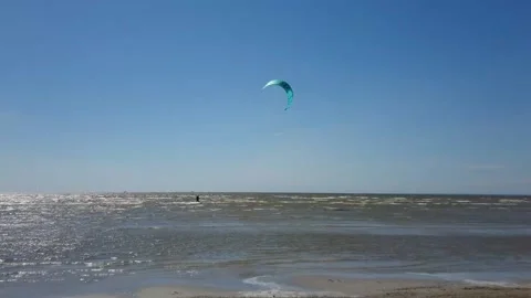 Kite surfer riding the waves Stock Footage 143903716