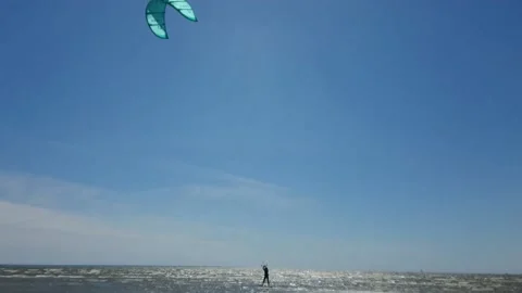 Kite surfer riding the waves Stock Footage 143903722