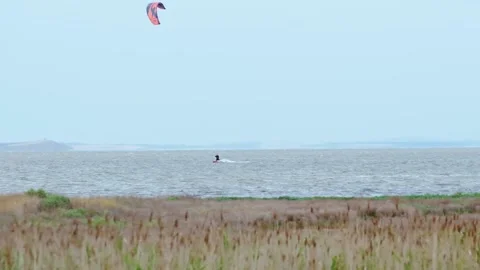 Kite surfer in the sea Stock Footage 140233284