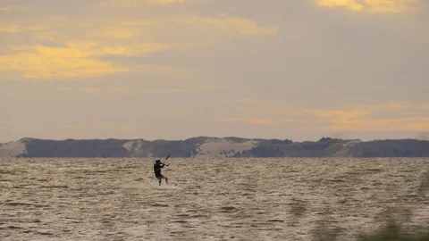 Kite surfer at sunset Stock Footage 82954545