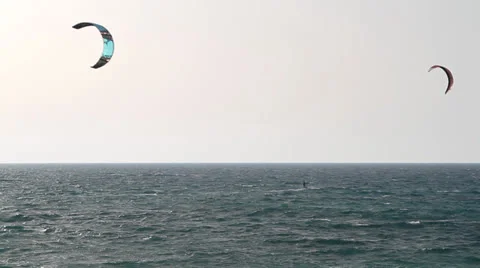 Kite surfers moving fast and jumping Stock Footage 25998992