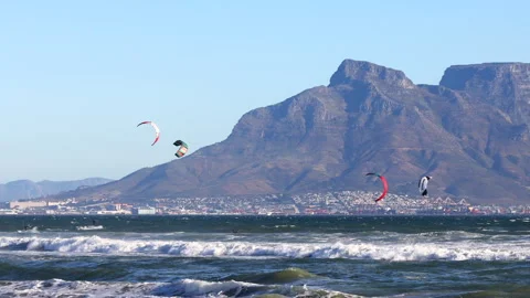 Kite surfers ride the waves in Cape Town Stock Footage 340558170