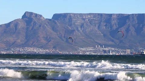 Kite surfers ride the waves in Cape Town Stock Footage 340558193