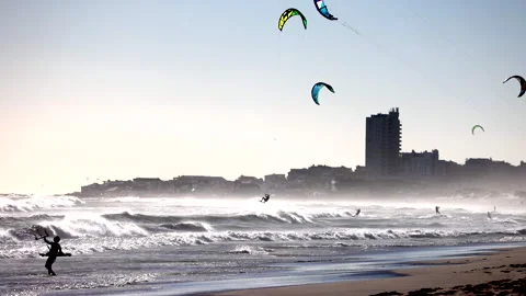 Kite surfers ride waves in Cape Town Stock Footage 340558466