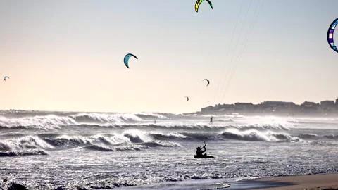 Kite surfers ride waves in Cape Town 스톡 동영상 340558875