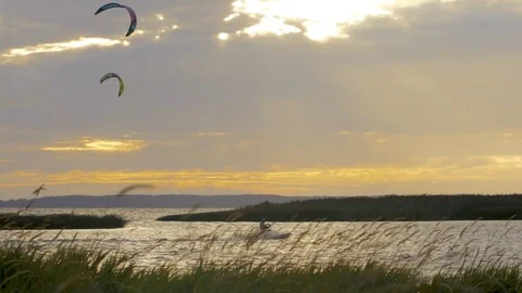 Kite surfers at sunset Stock Footage 82953909