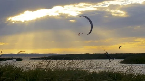 Kite surfers at sunset Stock Footage 82954870