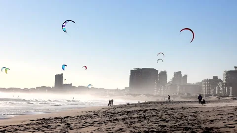 Kite surfers surfing at the beach Stock Footage 340558156