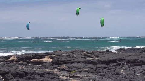 Kite surfers surfing in a beautiful turquoise sea Stock Footage