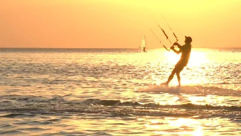 Kite surfing on the background of a beautiful sunset. Stock Footage 73305399