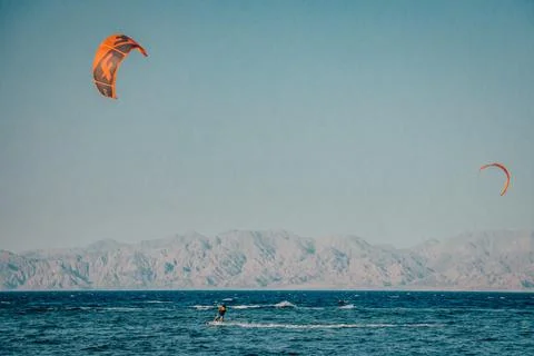Kite surfing in Dahab Egypt. Exploring the blue water with mountains Stock Photos