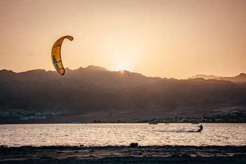 Kite surfing in Dahab Egypt. Exploring the blue water with mountains Stock Photos