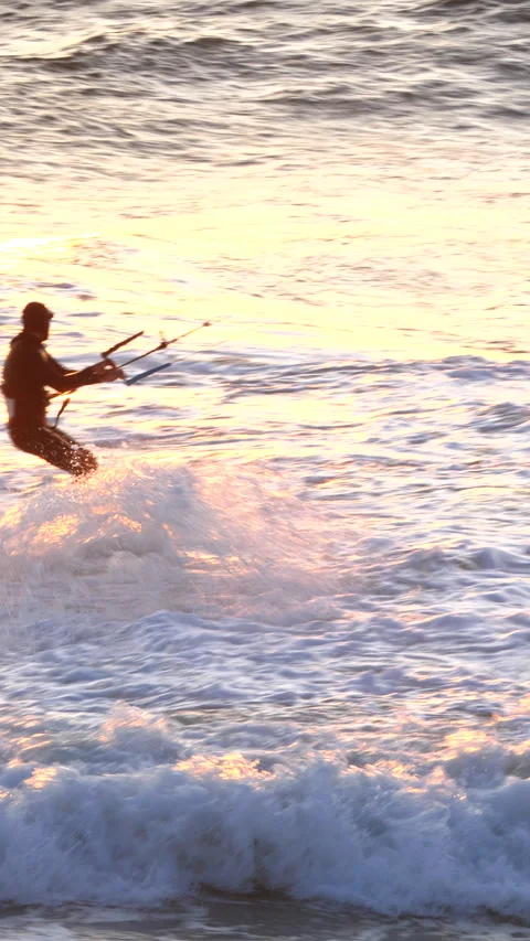 Kite surfing at sunset 4k vertical video Stock Footage 219384657