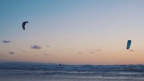 The kite-surfing surfer sails on the ocean wave. Canaries. Slow motion Видео 84768988