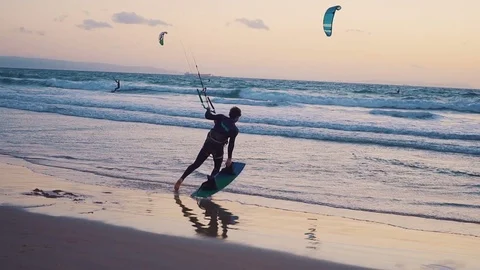 The kite-surfing surfer sails on the ocean wave. Miami. Slow motion Video stock 84801771