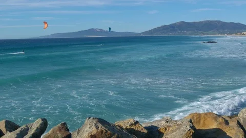 The kite-surfing surfer sails on the ocean wave. Spain. Tarifa. Stock-Footage 124011071
