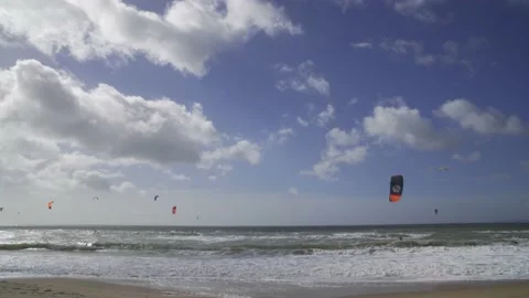 Kite surfing on windy day in rough sea on Southbourne Beach, Dorset Stock Footage 238528601